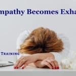 a therapist slumped across a desk, suffering compassion fatigue