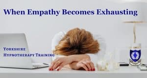 a therapist slumped across a desk, suffering compassion fatigue
