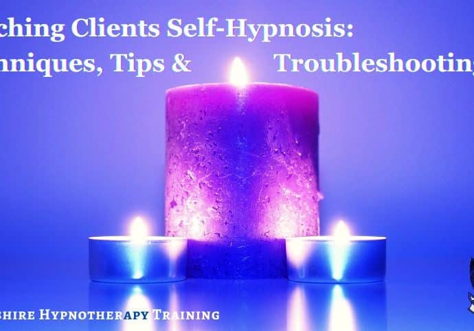 lit candles on a soothing blue background to signify calmness and self hypnosis